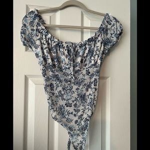 White/blue sheer ruffled bodysuit by Revamped
